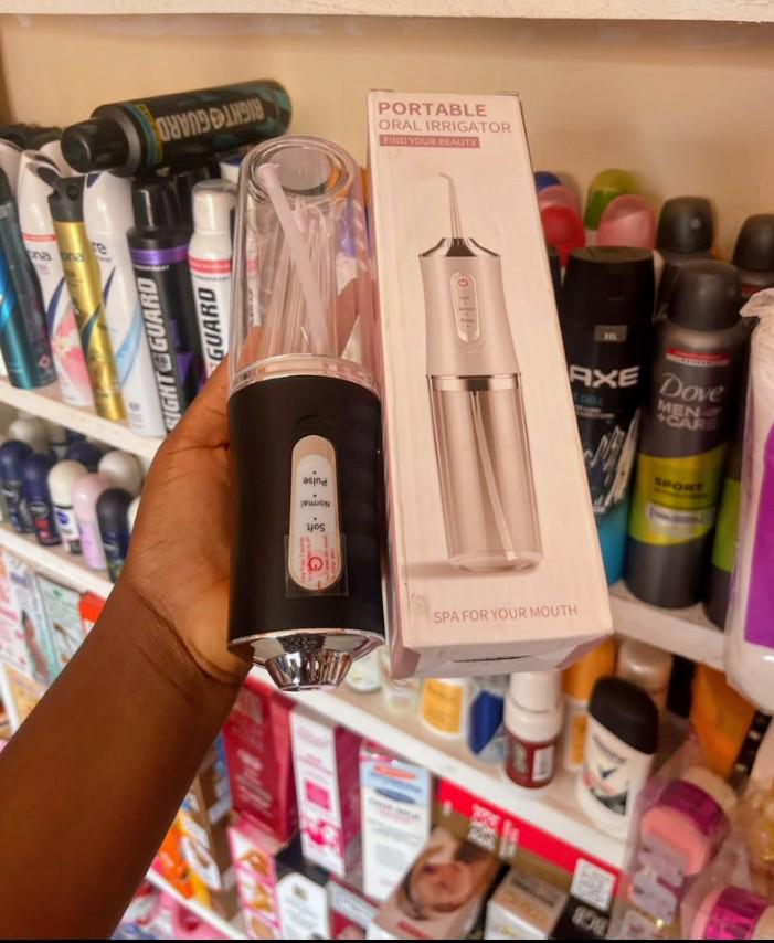 Potable oral irrigator