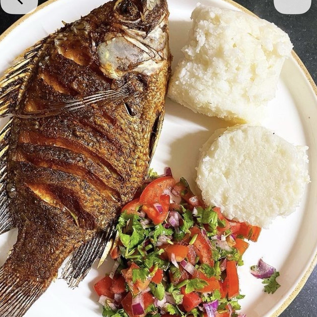 Spicy fried tilapia with gari(eba).