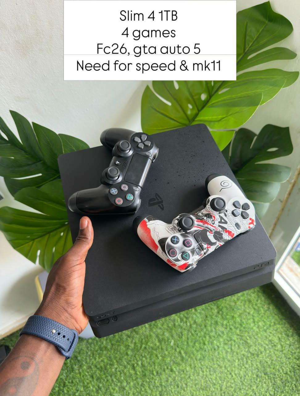 Preowned ps4 slim 1tb 4 games 2 controller fc26, gta auto 5, mkneed for speed